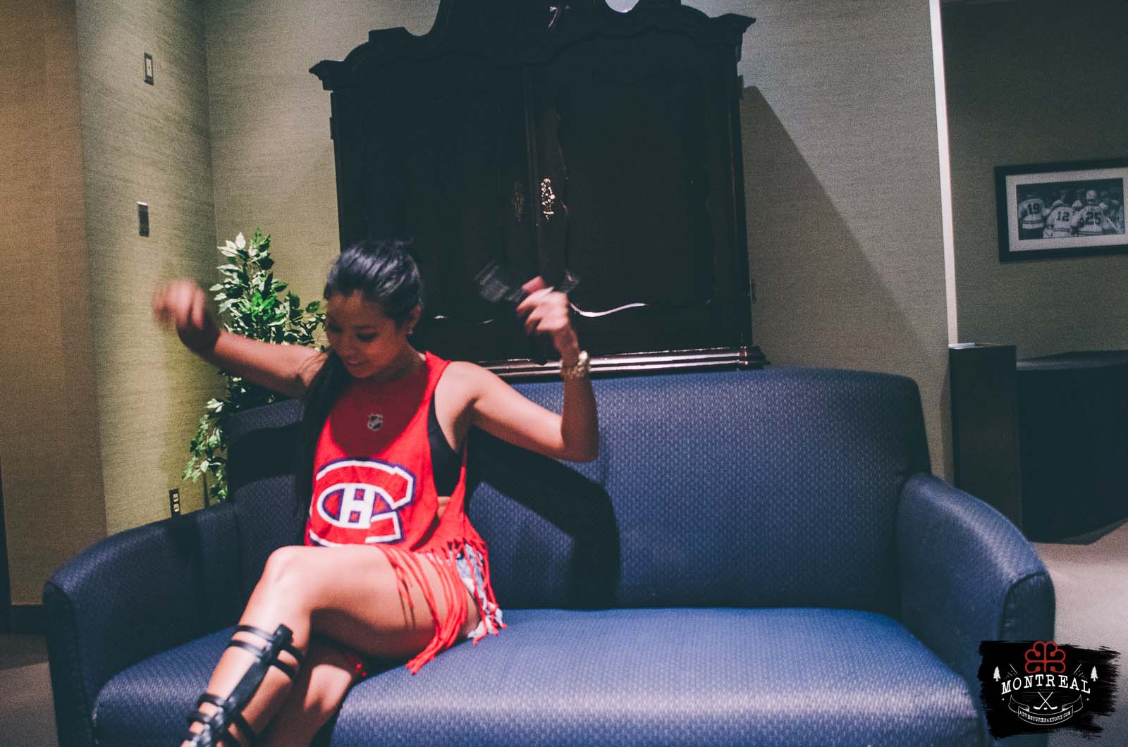 Thuymi getting excited to sit again on that chair after 9 years. This is Jean Beliveau's sofa when he would go to the Alumni's room. JB is also a Habs Legend.